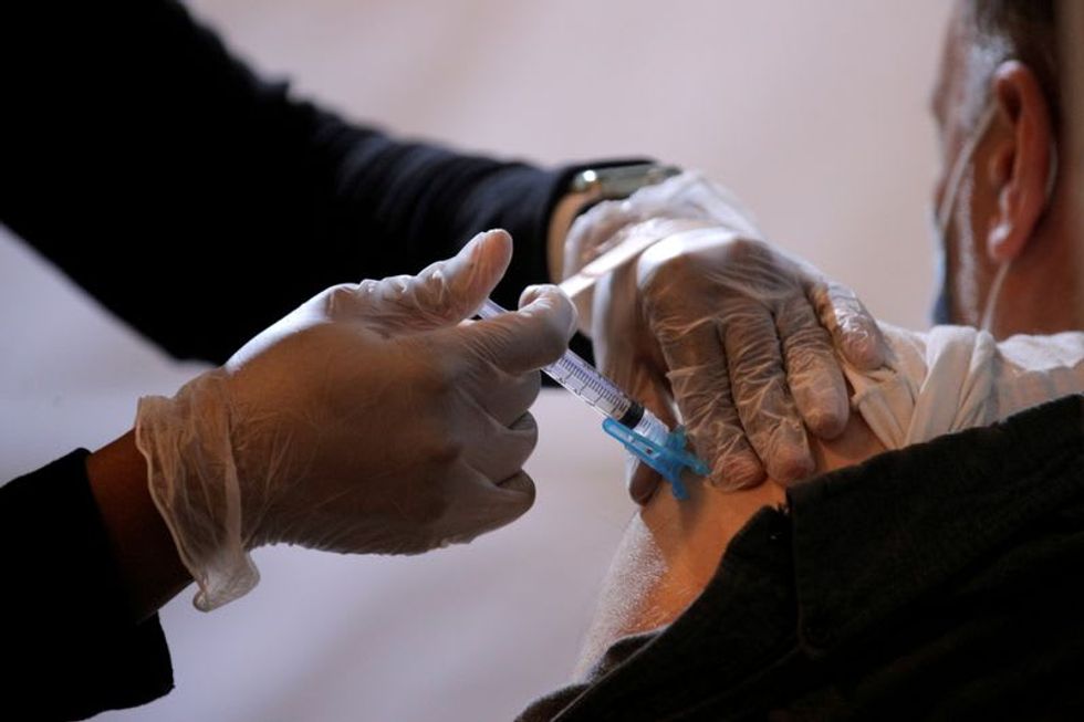 US closes in on 50 percent adult vaccination rate as COVID cases ebb