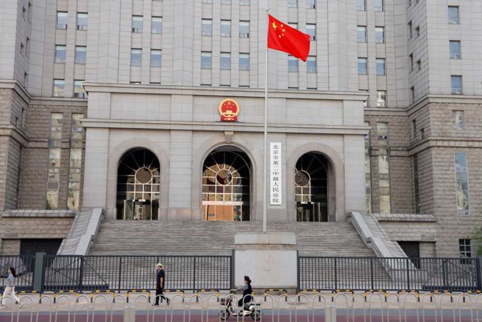 Australian blogger on trial in China worried political tensions may impact outcome