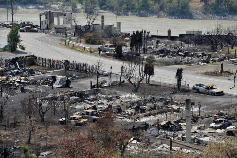 Residents of Canadian town destroyed by record-breaking fire return for glimpse of homes