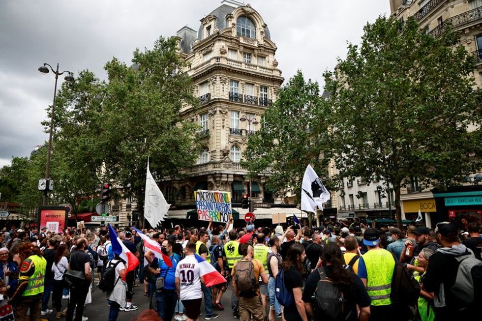 Thousands protest against COVID-19 health pass in France