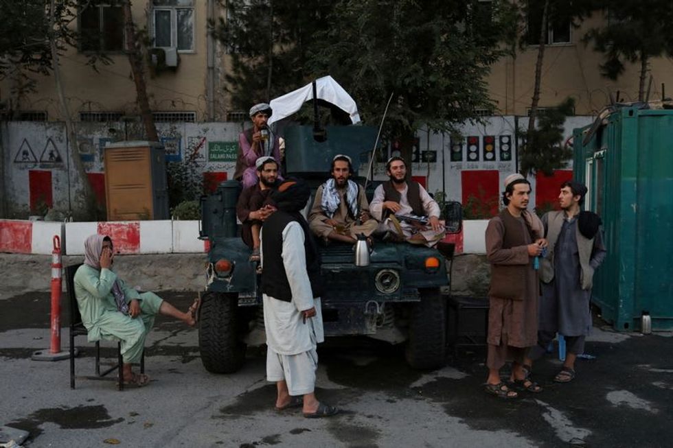 Taliban preparing to reveal new Afghan government amid economic turmoil