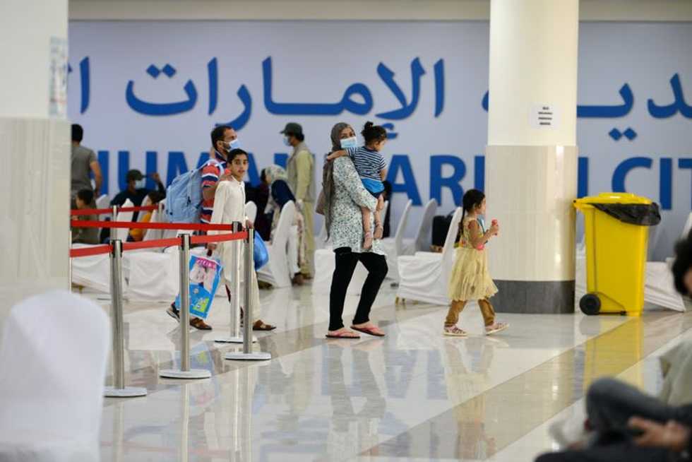 Evacuated Afghans, hoping to resettle in U.S., face extended limbo in third countries