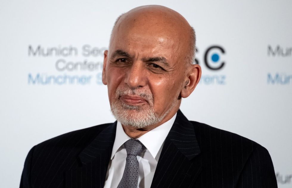 Former Afghan president apologizes for abandoning his country
