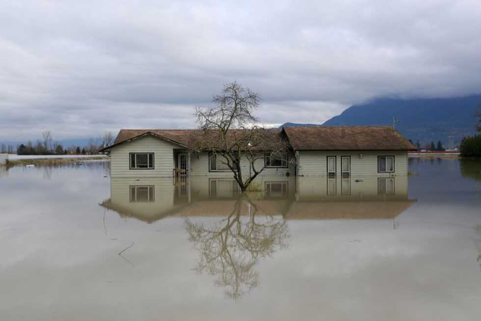 Flood-hit Canada province braces for heavy rain, three bodies found