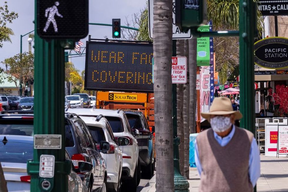 California to re-institute statewide mask mandate amid rise in COVID cases - Vimarsana News