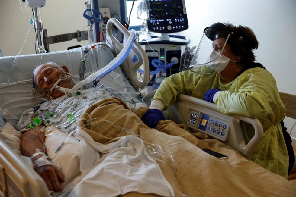 A year after first U.S. shots, pandemic hallmarks re-emerge