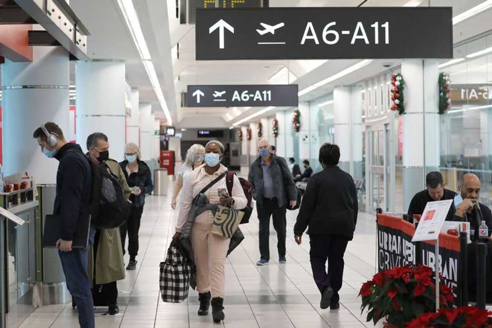 Canada likely to toughen travel curbs as Omicron concern grows - CBC