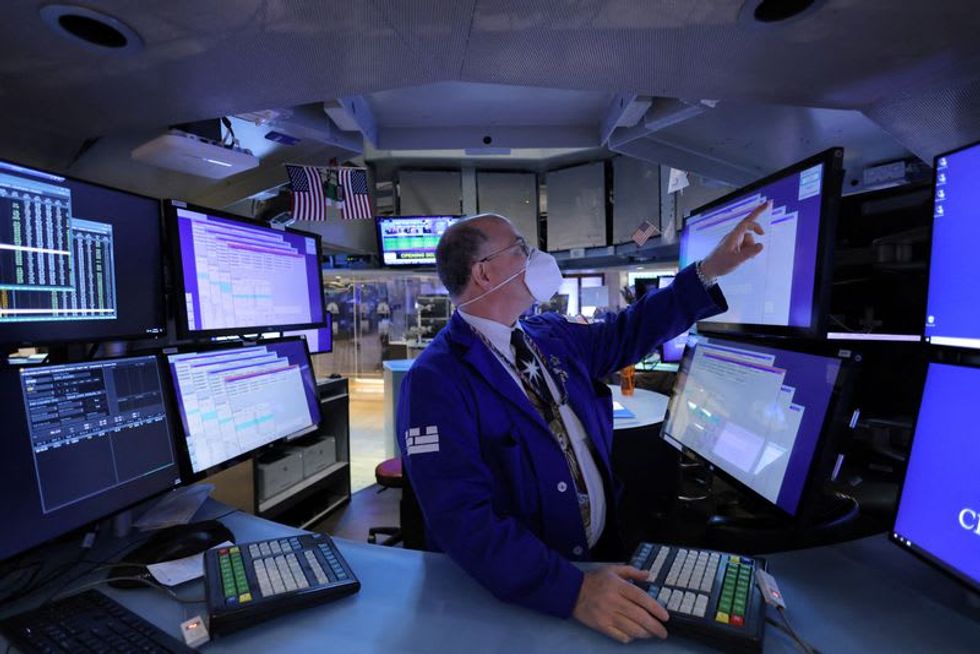 Wall Street ends tumultuous year near record highs