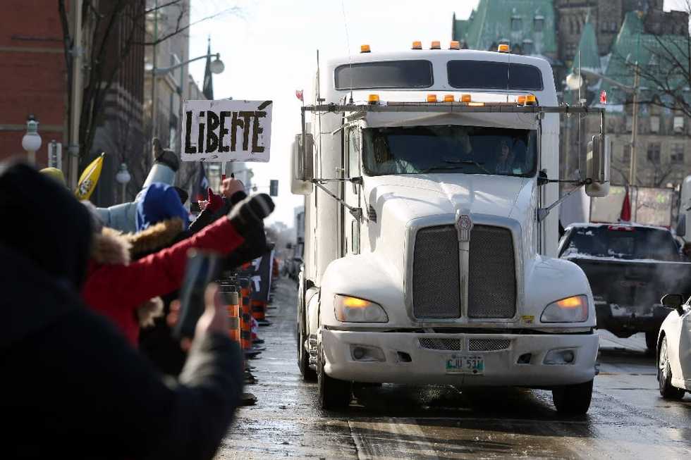 Hundreds of truckers pour into Ottawa to protest vaccine requirements