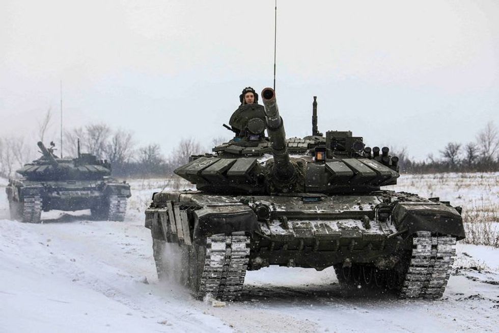 Russia says some troops pulled back from near Ukraine, West seeks proof
