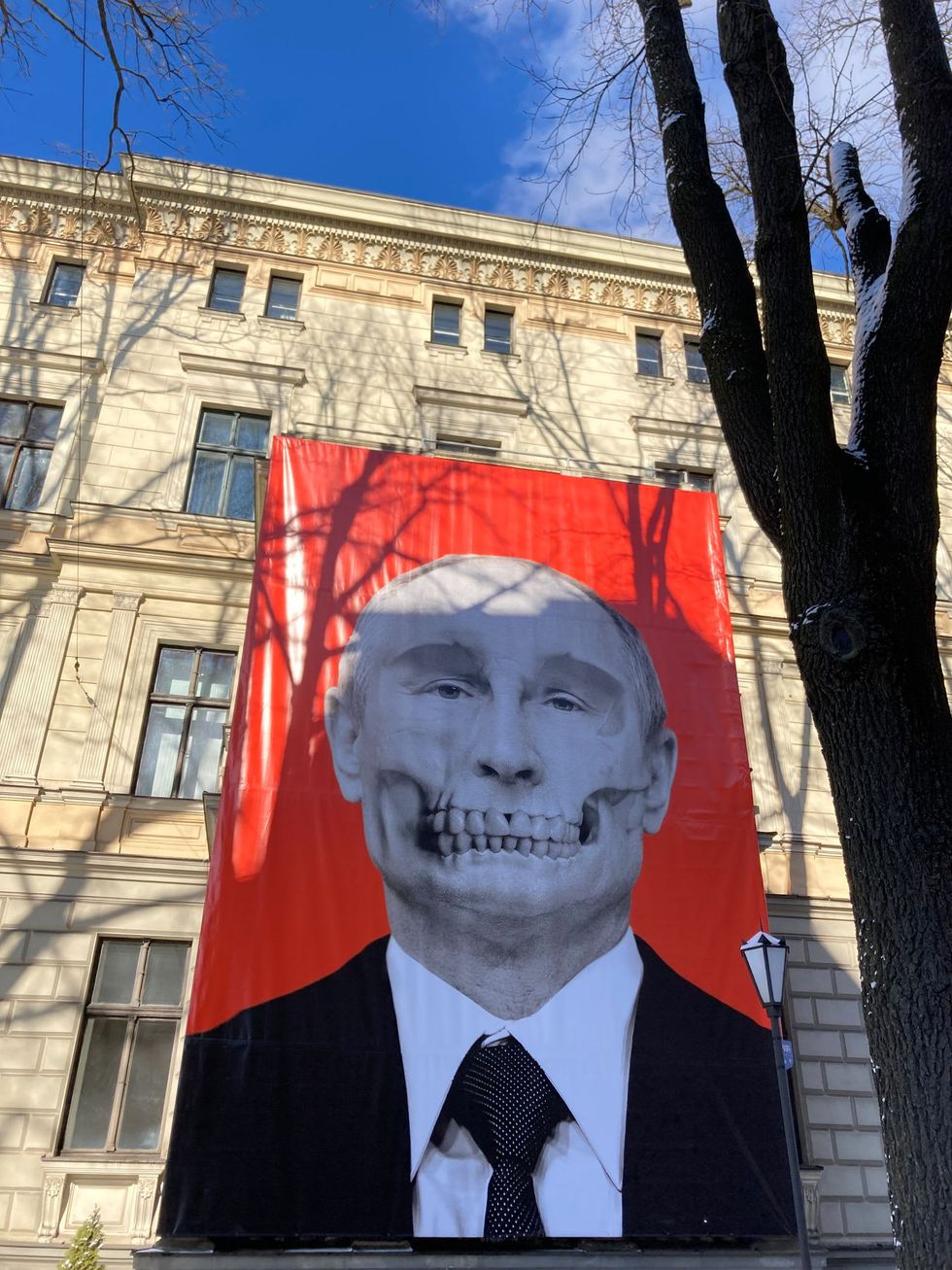Museum in Latvia unveils large poster of Putin stylized as a skull