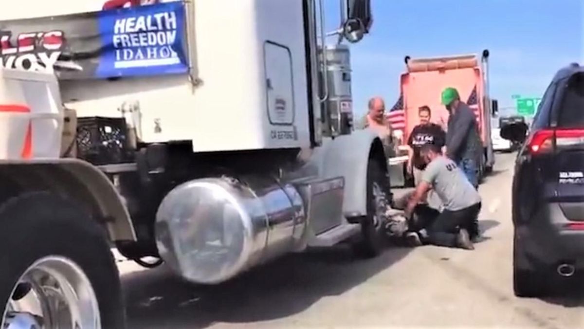 Video shows People's Convoy drivers pinning biker to the ground after he gave them the middle finger