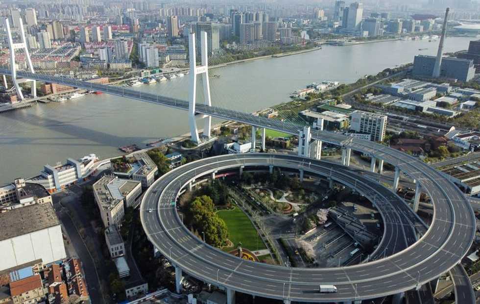 Shanghai expands COVID lockdown as new daily cases surge by a third