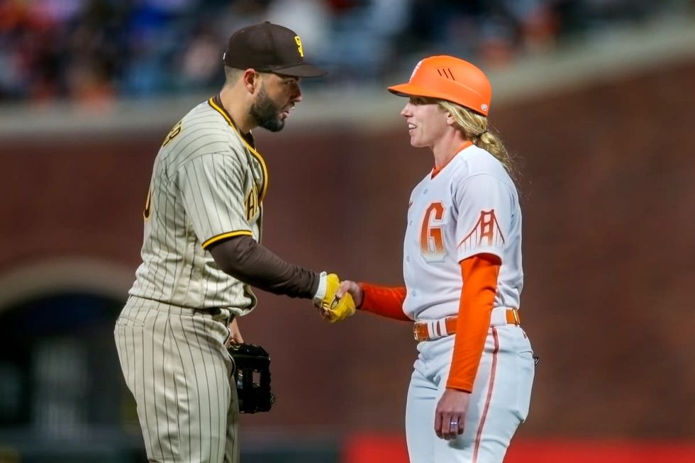Of course the first woman to coach on an MLB field was immediately undercut by a comment about her looks