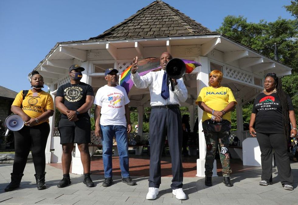 Georgia activists march on Stone Mountain monument to the 'racist traitors' of the Confederacy