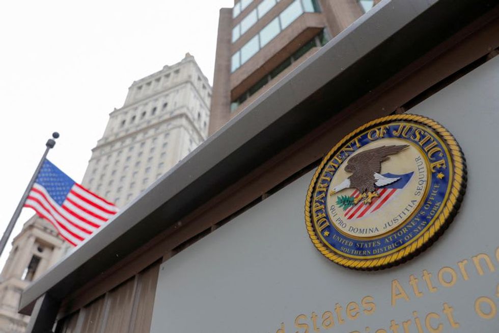 U.S. charges one American, four Chinese officials with spying