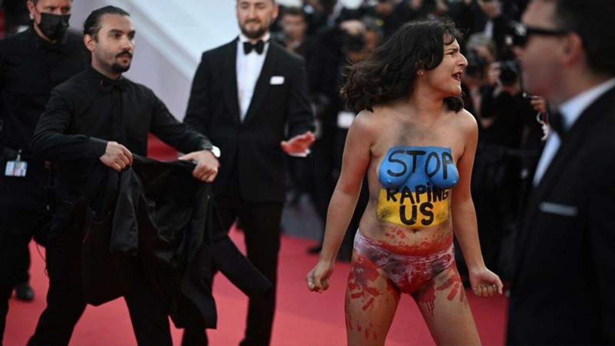 Woman storms Cannes red carpet to protest Ukraine rapes