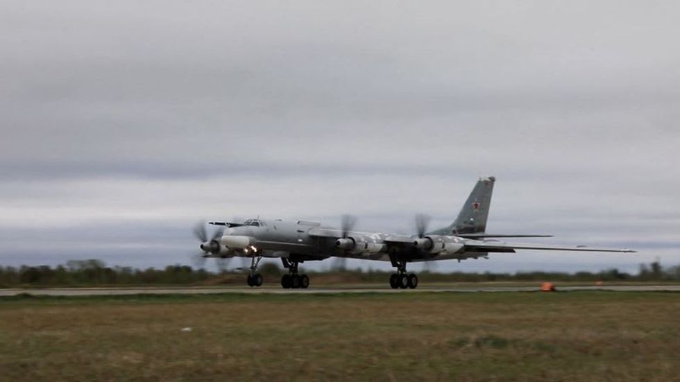 Russian and Chinese jets deliver pointed send-off on last day of Biden Asia trip