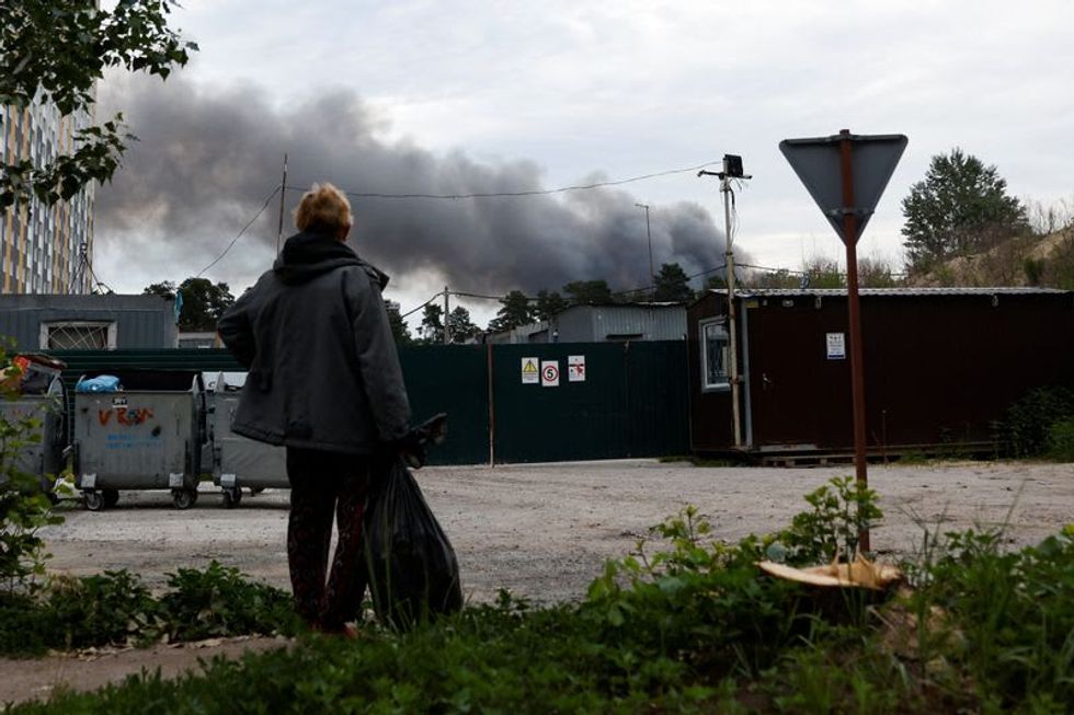 Explosions rock Ukraine's capital Kyiv, battle rages on in east
