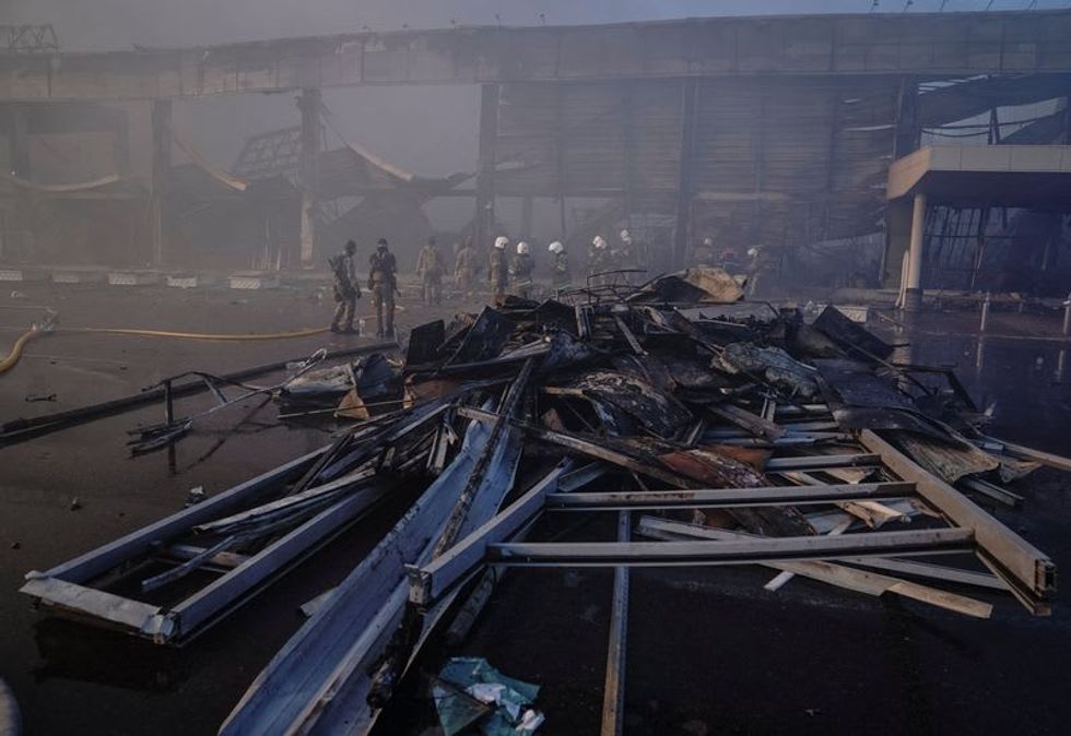 Rescuers dig for survivors after Russian missiles pound Ukrainian shopping mall