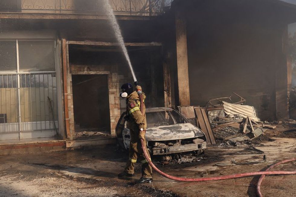 Wildfires rage across Europe as climate alarm sounded