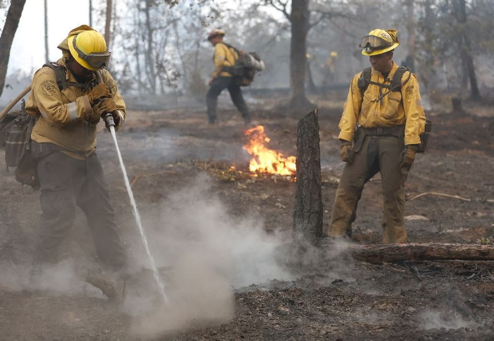 Firefighters tackle California wildfire as heat wave grips parts of US