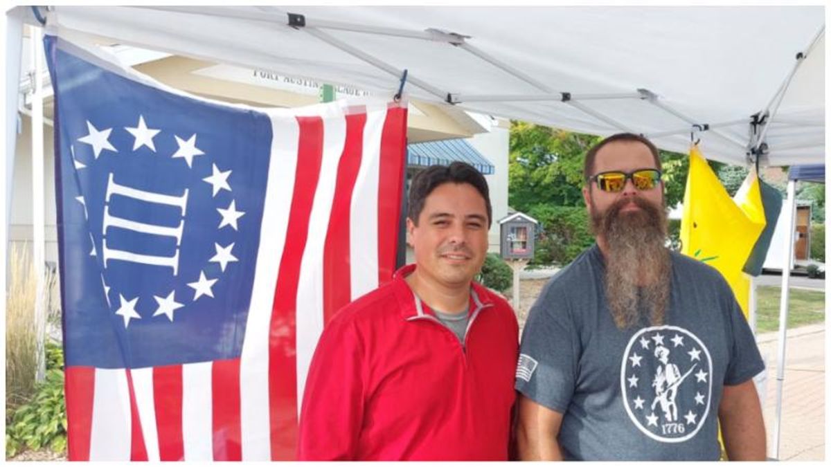 Michigan GOP candidate deletes photo of him standing in front of anti-government militia's flag