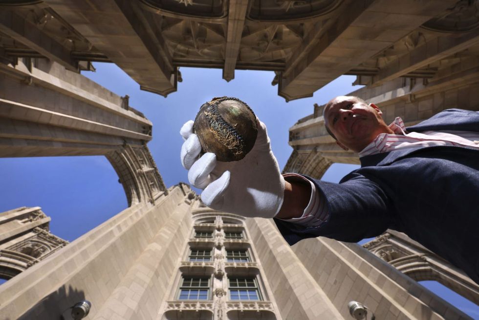Buried deep in a time capsule for a century, a 1919 ‘Black Sox’ World Series baseball sees the light