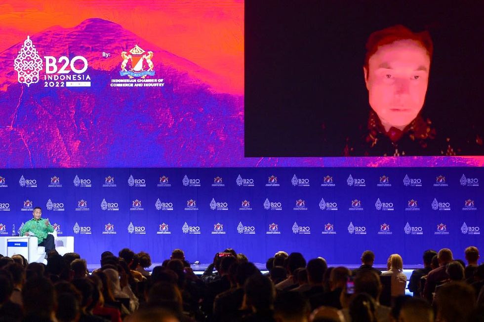 Musk sees aliens, tunnels in a candlelit G20 vision of the future