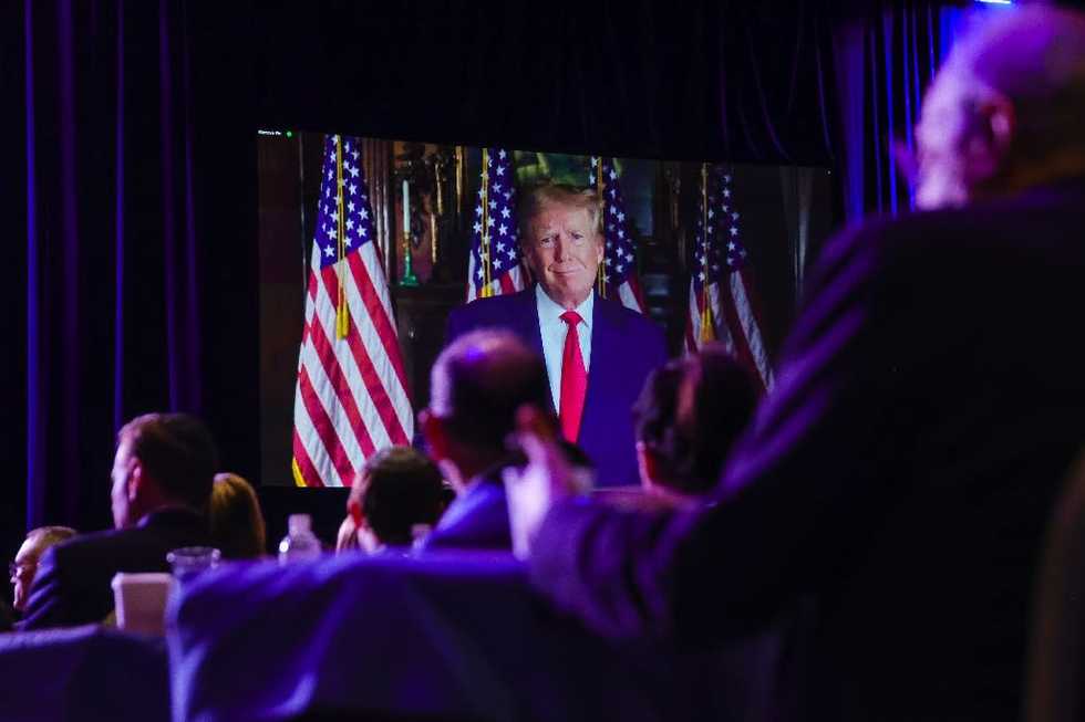 Trump gets warm reception at Republican gathering as rivals lash out