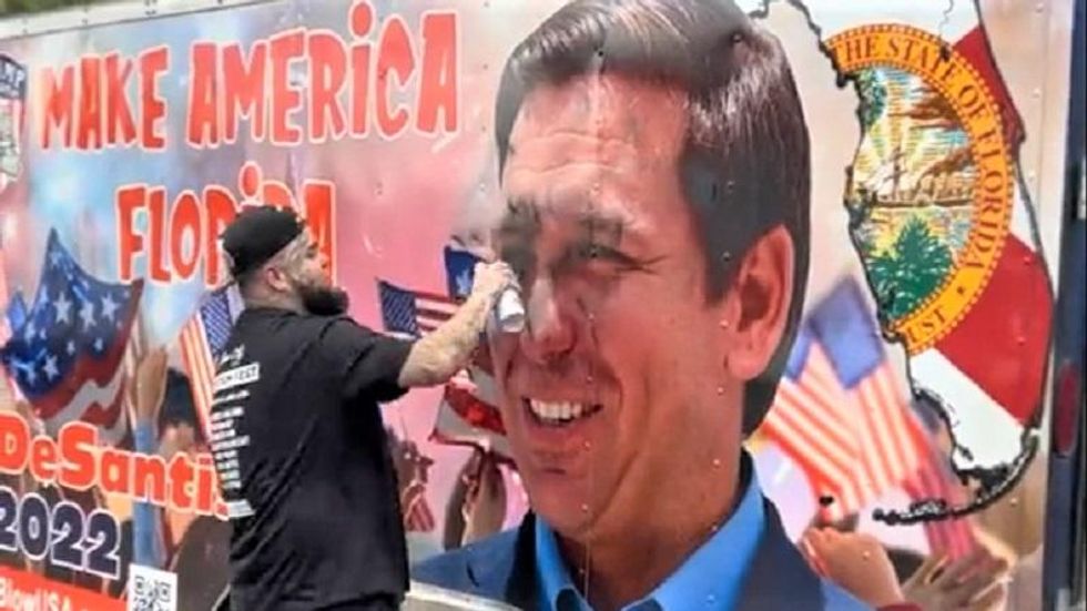 Trump-loving Florida rapper films himself defacing DeSantis mural in warning shot over 2024 run