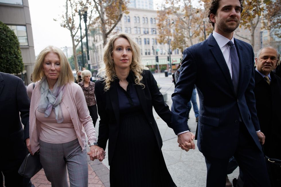 Feds say Elizabeth Holmes ‘attempted to flee’ the US with one-way ticket after conviction