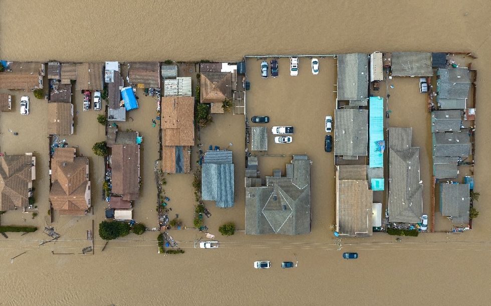 Latest California storm leaves at least two dead, breaks levee