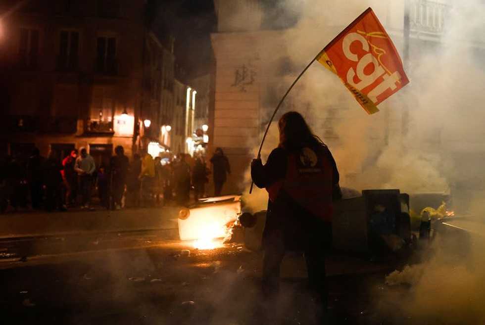 Police fire tear gas at spontaneous anti-pension bill protest in Paris