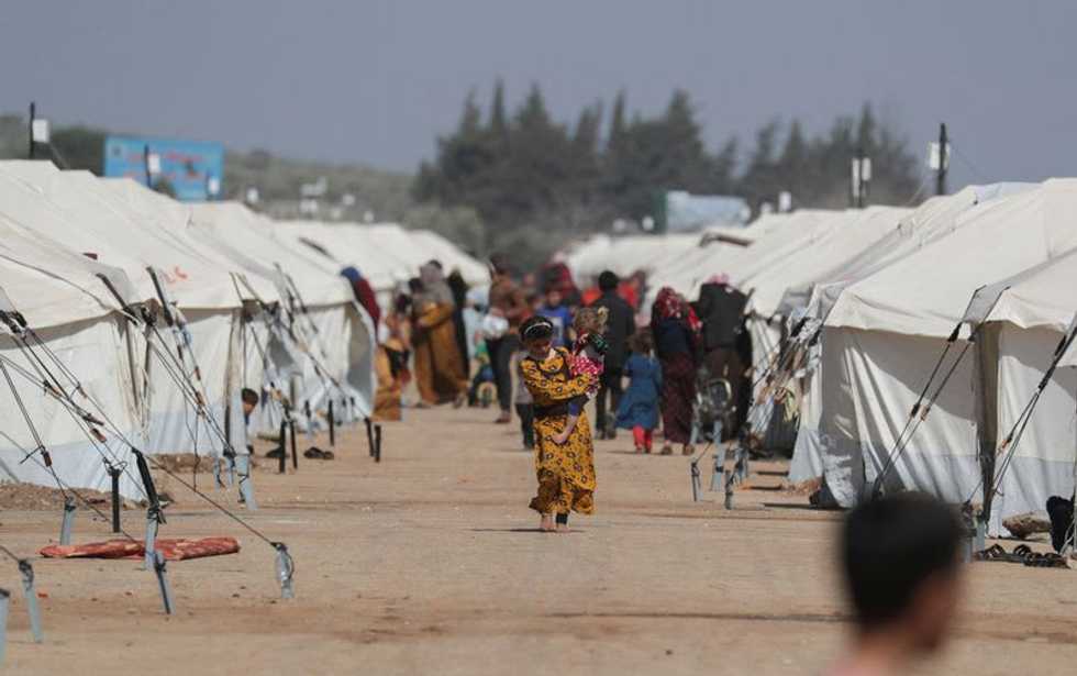 At graveyard of unknown quake victims, Syrians seek news of the missing