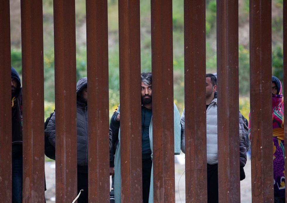 Migrants say Border Patrol is keeping them between the border walls for days without food or shelter