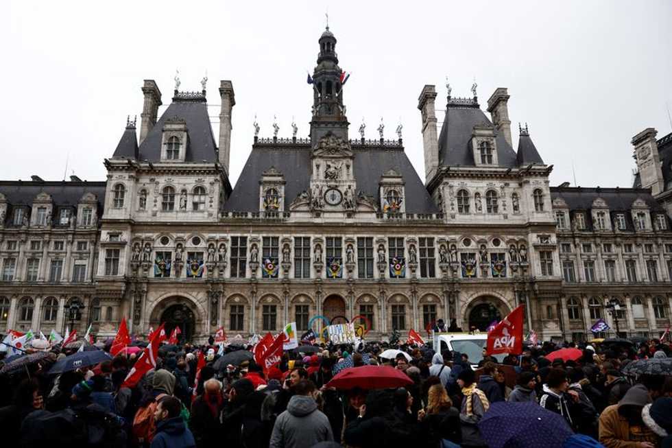 France's Macron signs contested pension bill into law