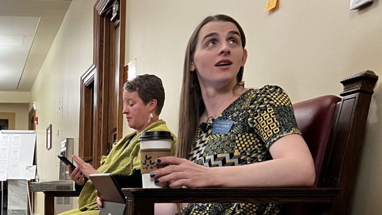 Zephyr working from bench outside Montana House floor; while her committee meetings cancelled