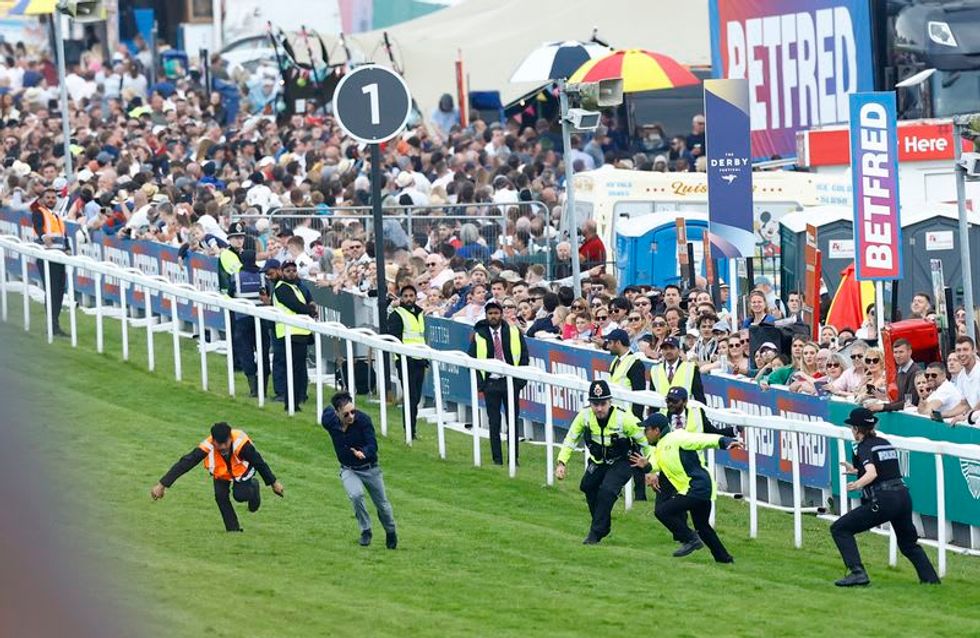Horse racing-Protester runs onto track as 31 arrested over Epsom Derby disruption