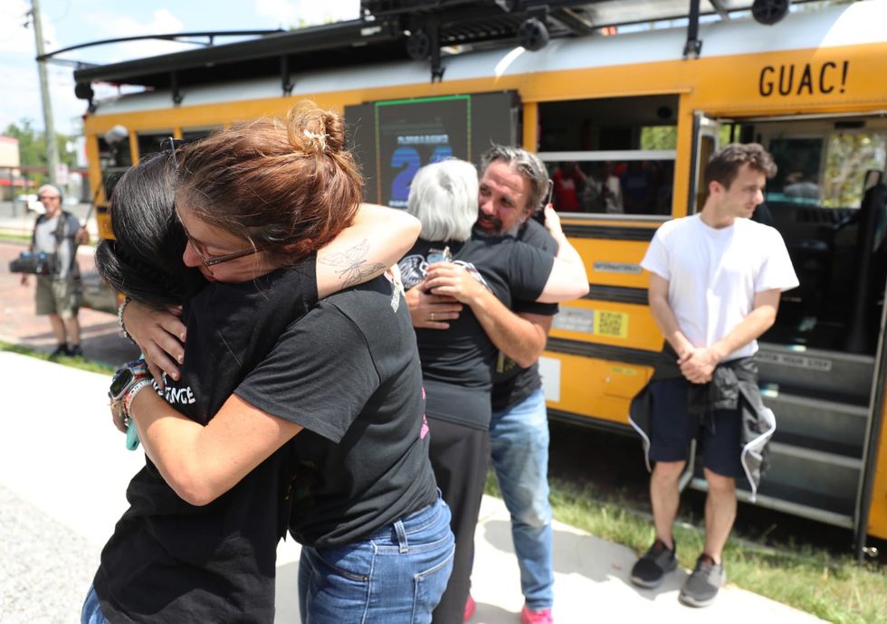 Parents of teen killed in Parkland shooting visit Pulse memorial as they begin bus tour
