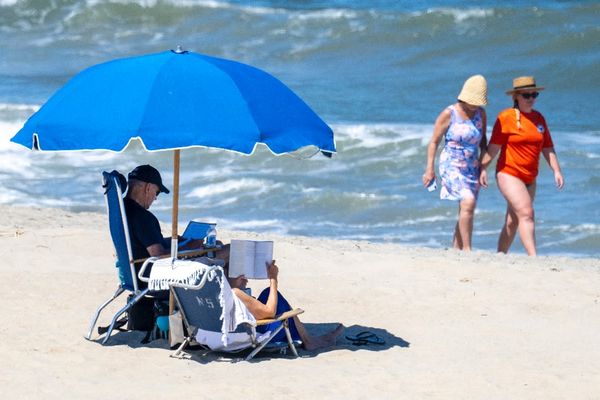 Biden hits the beach - and ditches the shirt