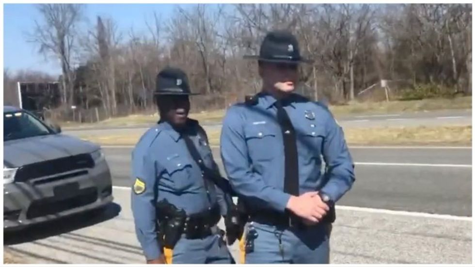 Dash cam footage shows Delaware cops conspiring to drum up bogus charge against motorist who flipped them off