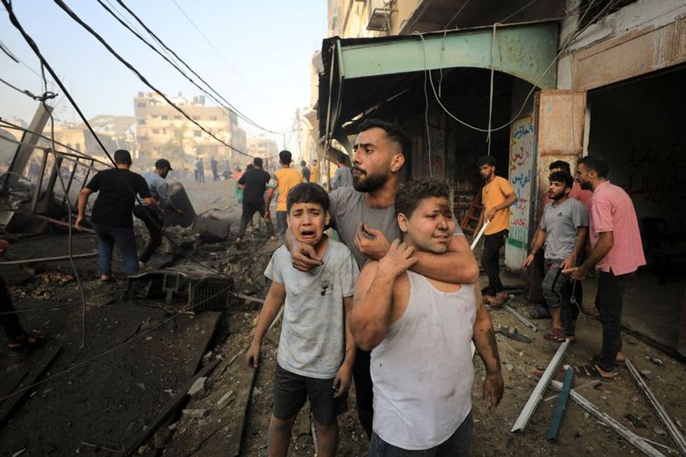 Israel bombards Gaza, prepares invasion as Biden urges path to two states