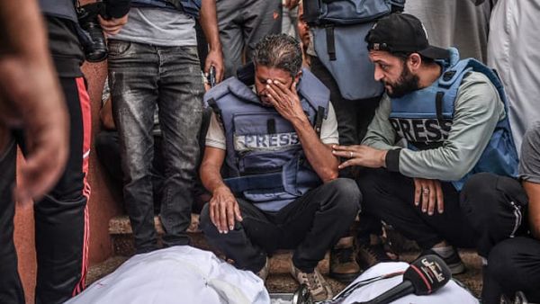 Gaza reporter rips off press vest on-air as colleague dies