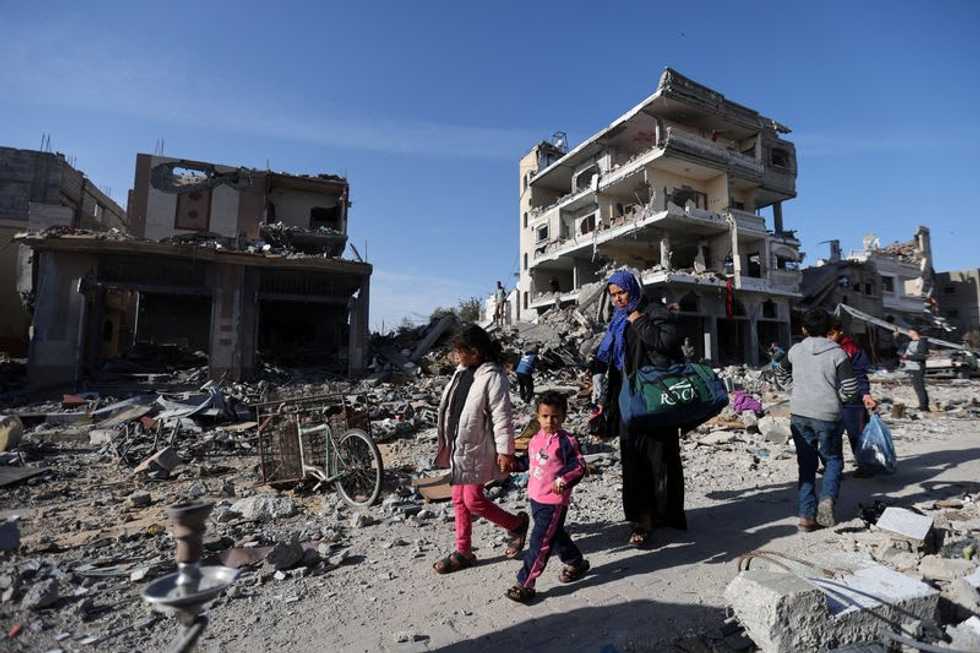 Palestinians in Gaza use truce to pick through rubble of homes