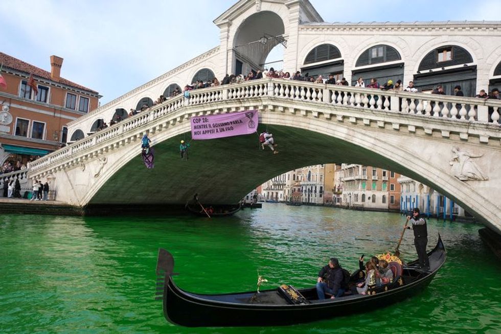 Italian climate change protesters turn Venice's Grand Canal green