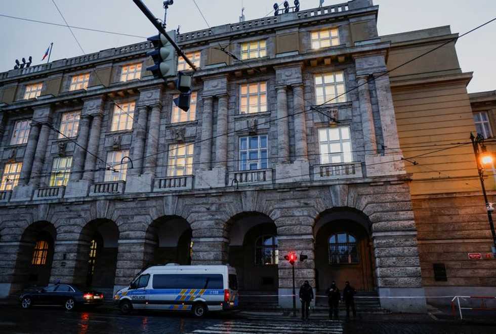 'Shoot here!': reporter screams at Prague gunman to help people flee