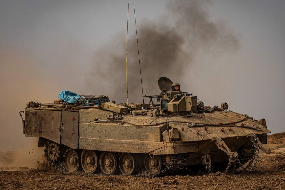 Israel expects long war, rotates troops, as Gaza death toll rises