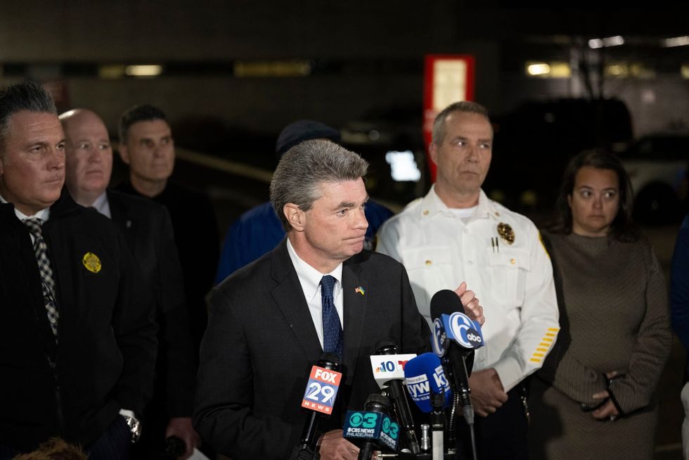 Multiple family members unaccounted for at Pennsylvania home razed in a fire after 2 officers were shot