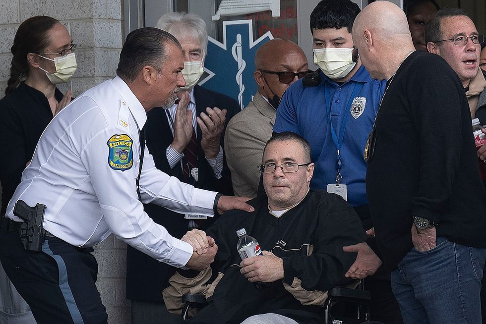Gunman who fired at 2 officers is presumed dead, along with 5 relatives, sources say